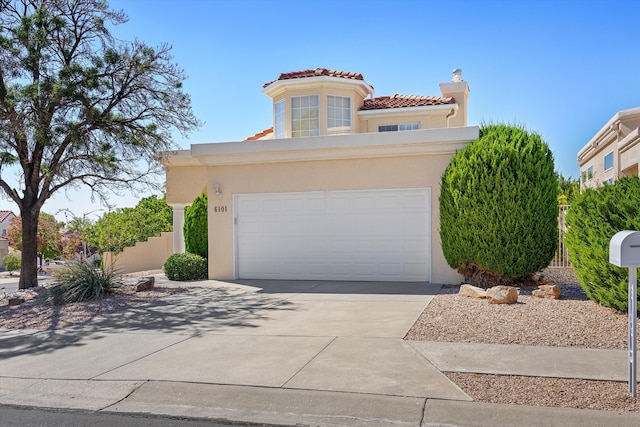 mediterranean / spanish-style house featuring a garage