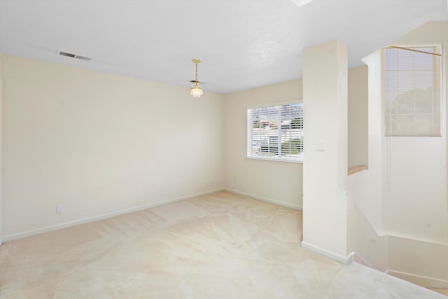 unfurnished room with light colored carpet