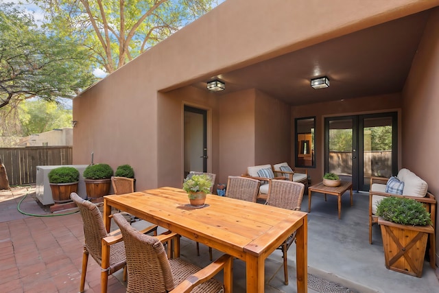 2616 Don Pedro NW, Albuquerque, NM 87104 - view of patio / terrace featuring outdoor dining area, fence, and french doors