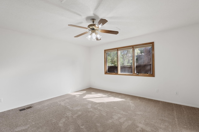 2616 Don Pedro NW, Albuquerque, NM 87104 - spare room with baseboards, visible vents, ceiling fan, and carpet flooring