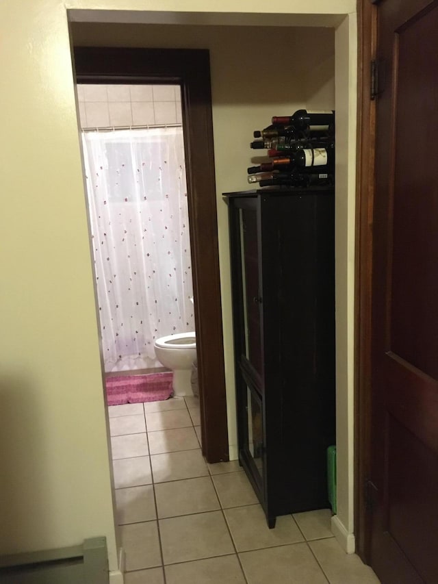 corridor featuring light tile patterned flooring