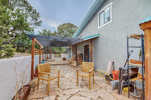 view of patio featuring a pergola