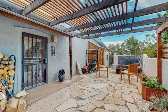 view of patio featuring a pergola