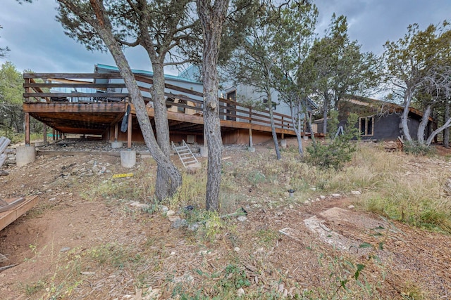 rear view of property with a wooden deck