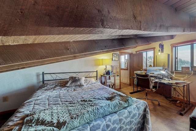 carpeted bedroom featuring wood ceiling and vaulted ceiling