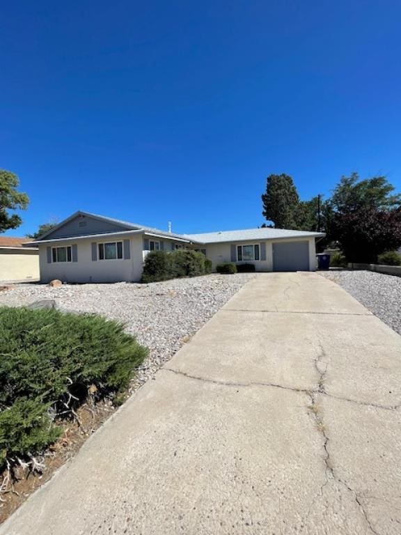 single story home featuring a garage