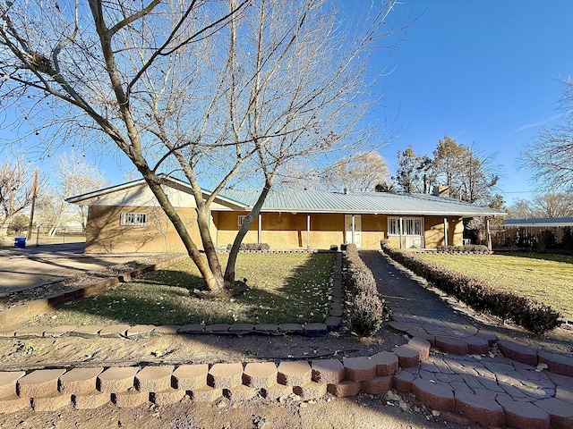 ranch-style house with a front lawn