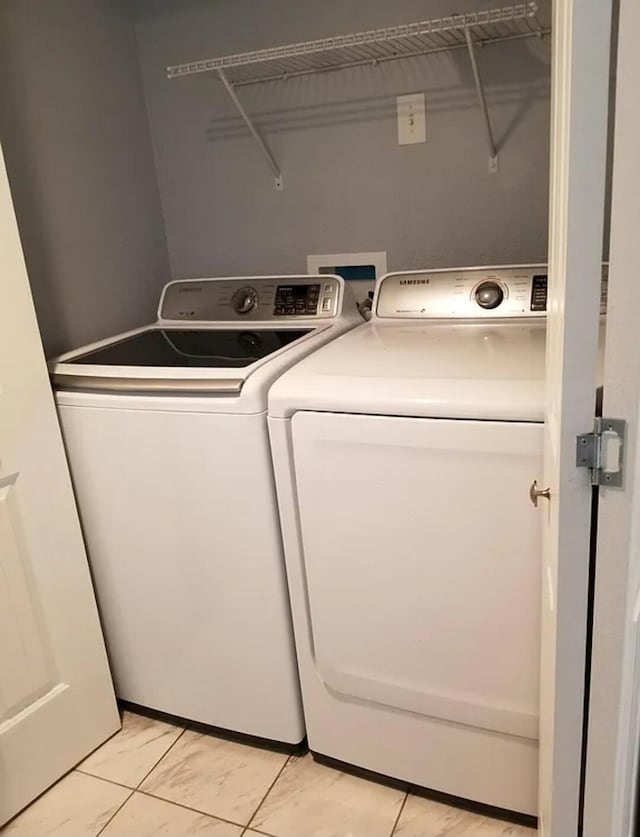 laundry area featuring washing machine and dryer