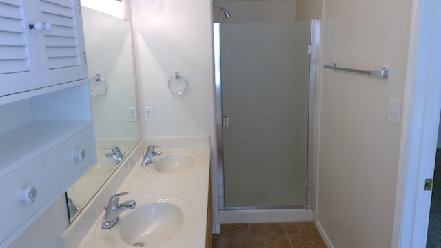 bathroom featuring walk in shower, tile patterned flooring, and vanity