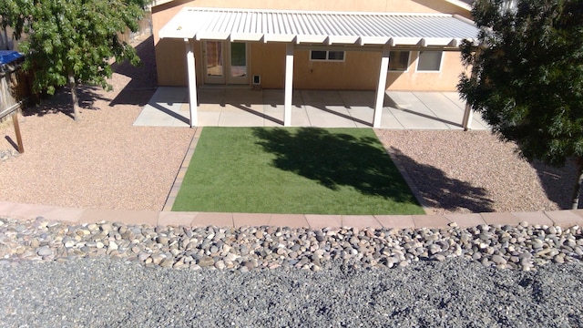 back of property featuring a patio