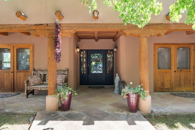 property entrance featuring a patio area