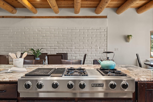 details featuring wood ceiling, beam ceiling, and dark brown cabinetry