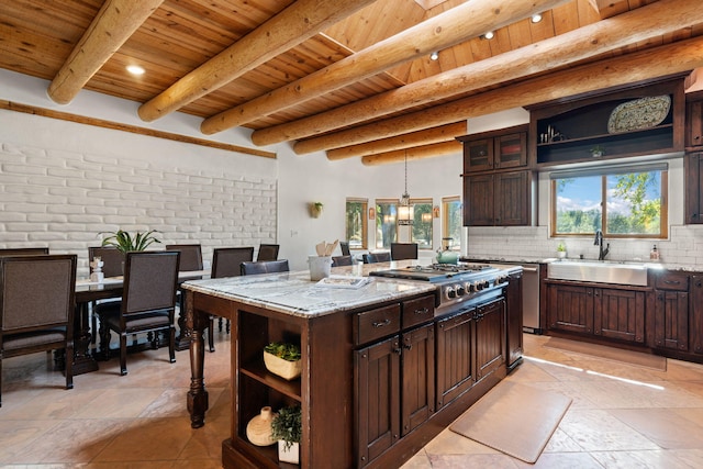 kitchen with light stone counters, sink, a kitchen island, stainless steel appliances, and wooden ceiling