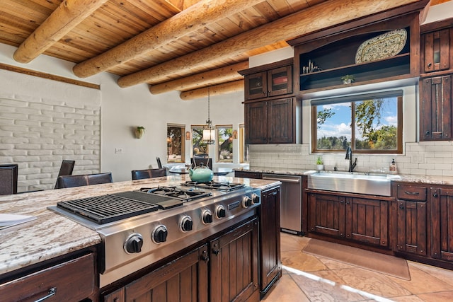 kitchen with light stone counters, sink, hanging light fixtures, appliances with stainless steel finishes, and wooden ceiling