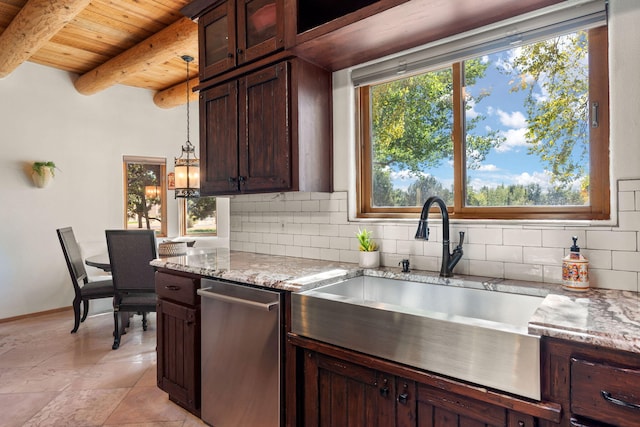 kitchen featuring decorative backsplash, light stone countertops, beamed ceiling, decorative light fixtures, and stainless steel dishwasher