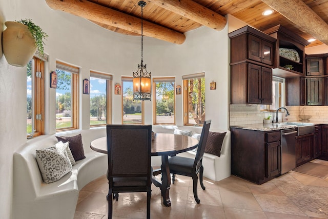 dining space with wood ceiling, beamed ceiling, and a wealth of natural light