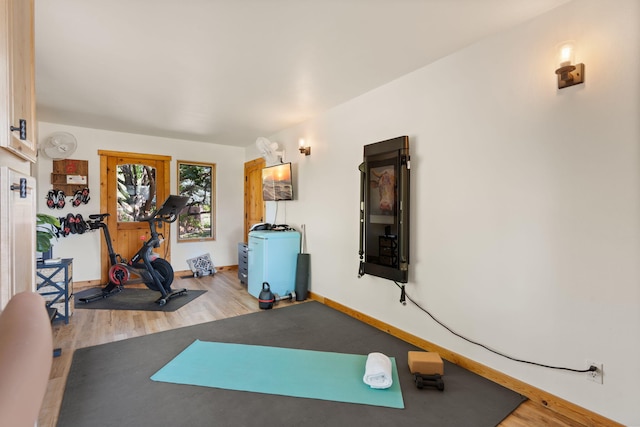 workout area with light wood-type flooring