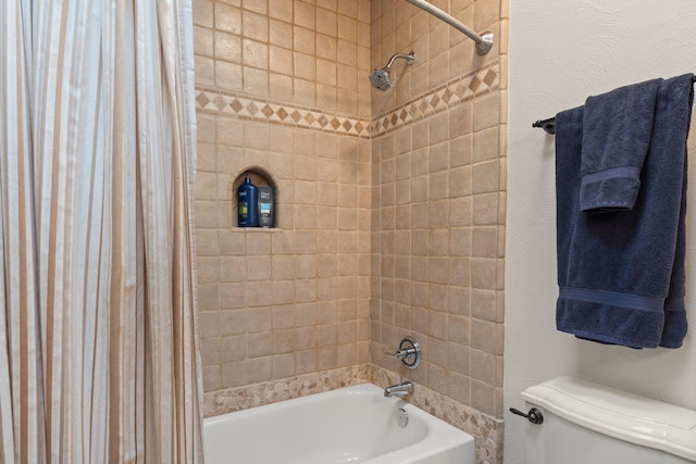 bathroom with shower / bath combo with shower curtain and toilet