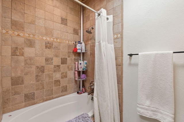 bathroom featuring shower / tub combo with curtain