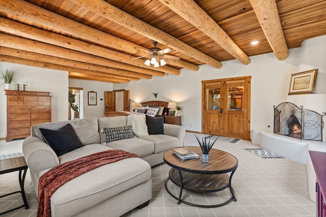 living room featuring ceiling fan, wood ceiling, and beam ceiling