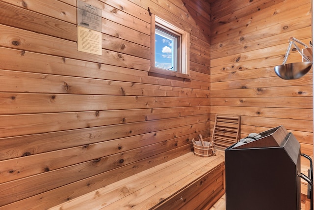 view of sauna with wooden walls