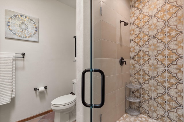 bathroom with tile patterned flooring, toilet, and an enclosed shower