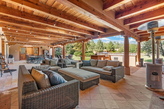 view of patio with an outdoor hangout area and grilling area