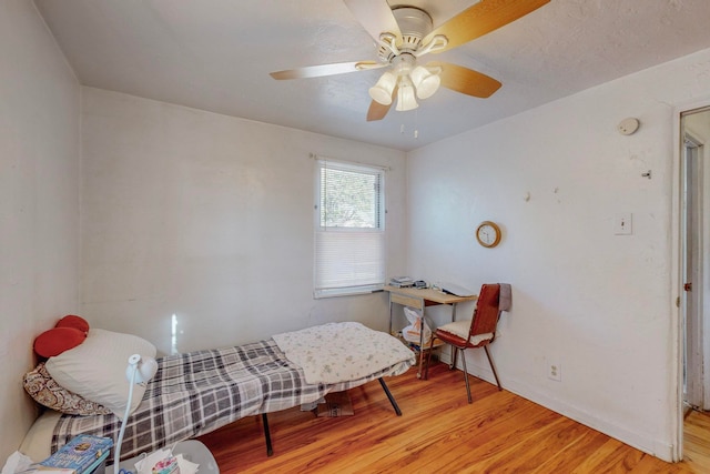 bedroom featuring ceiling fan and light hardwood / wood-style floors