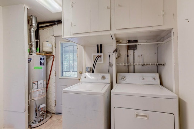 laundry area featuring water heater, light tile patterned flooring, washing machine and clothes dryer, and cabinets