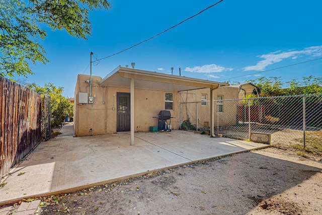 back of house with a patio area