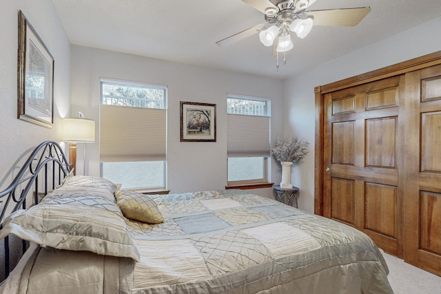 carpeted bedroom with ceiling fan