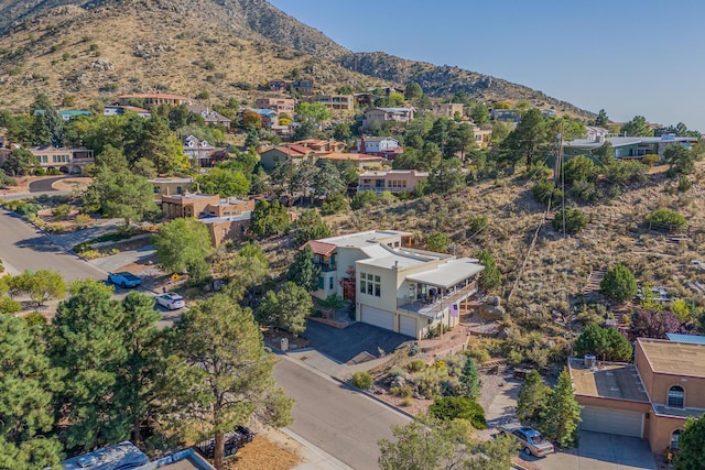 birds eye view of property featuring a mountain view