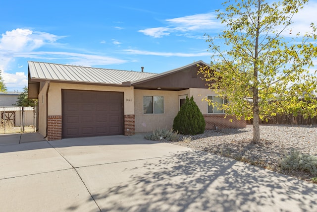 single story home featuring a garage