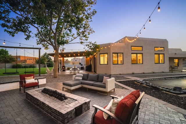 view of patio featuring fence and an outdoor living space