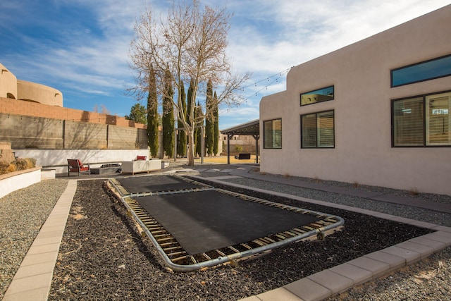 view of yard featuring a patio area and fence