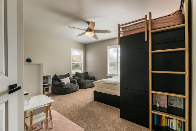 carpeted bedroom featuring a ceiling fan