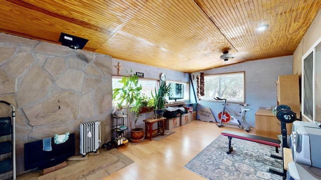 misc room featuring wood ceiling, radiator, vaulted ceiling, and light hardwood / wood-style floors