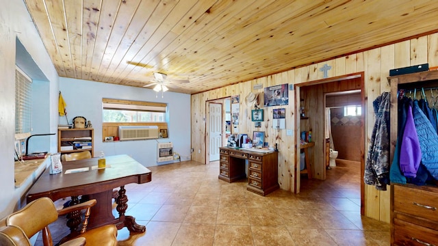 interior space featuring wood ceiling, heating unit, light tile patterned flooring, wood walls, and ceiling fan