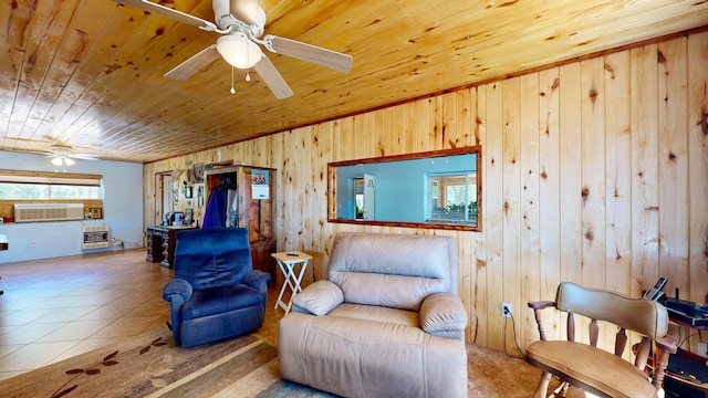 living area featuring wood ceiling, heating unit, wood walls, tile patterned floors, and ceiling fan