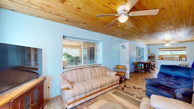 living room featuring light hardwood / wood-style flooring, ceiling fan, and plenty of natural light