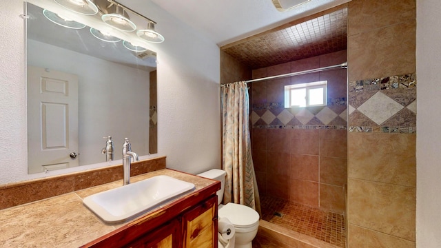 bathroom featuring vanity, toilet, and a shower with curtain