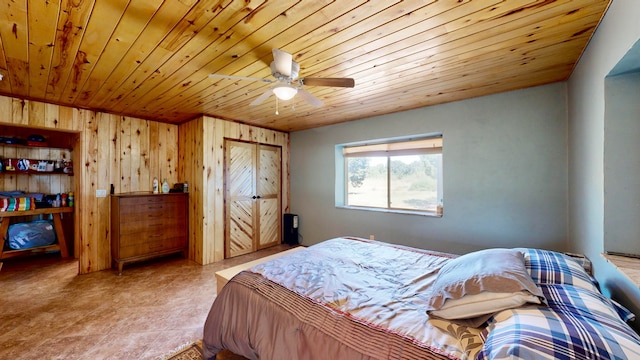 bedroom featuring wooden walls, ceiling fan, and wooden ceiling