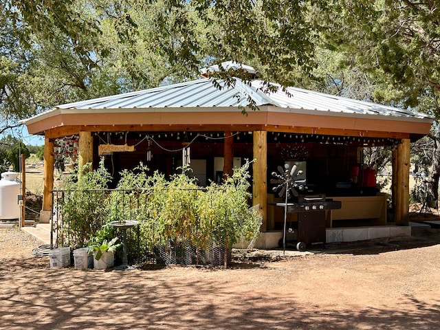 back of house featuring a gazebo