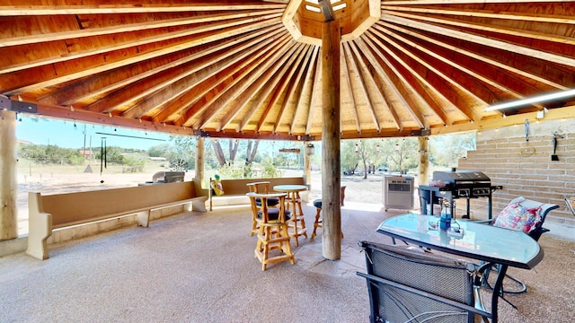 view of patio / terrace with grilling area and a gazebo