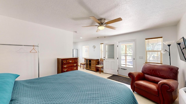 bedroom featuring a textured ceiling, ceiling fan, and access to exterior