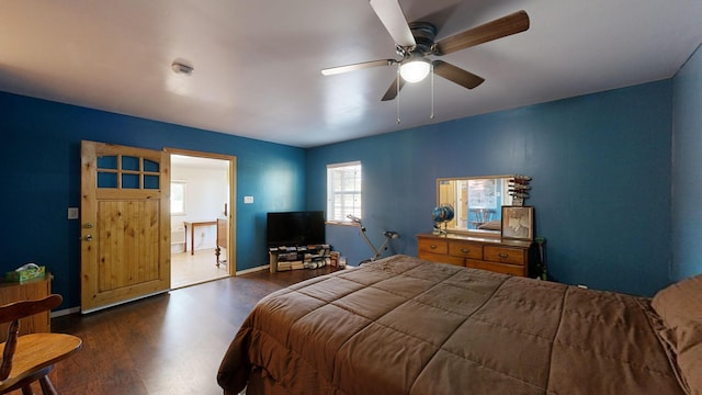 bedroom featuring ceiling fan and dark hardwood / wood-style floors