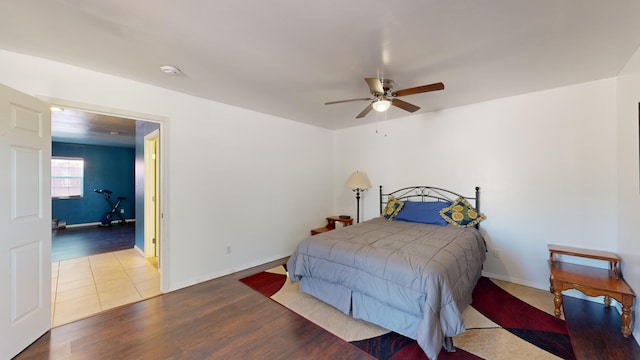 bedroom with wood-type flooring and ceiling fan