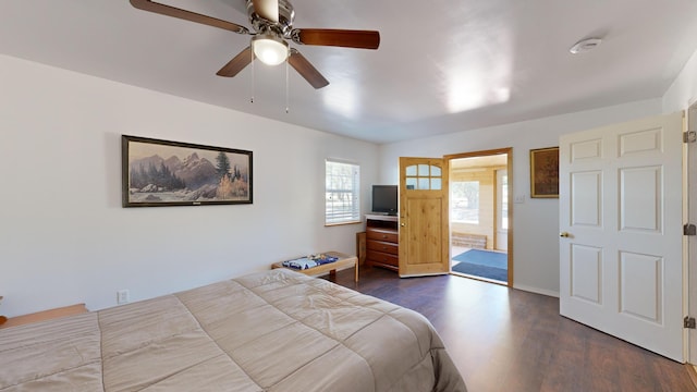 bedroom with ceiling fan and dark hardwood / wood-style floors