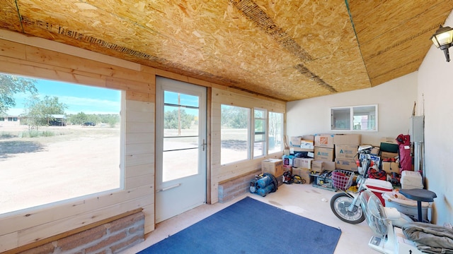 sunroom / solarium with vaulted ceiling