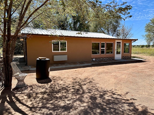 rear view of house featuring a patio area